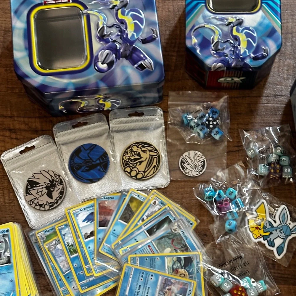 Pokemon Card Collection with Tins and Accessories 25 card Mystery Tin plus bonus